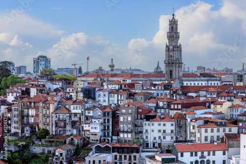 View over the colourful houses towards the Torre dos Clerigos in the old town of Porto, Portugal.