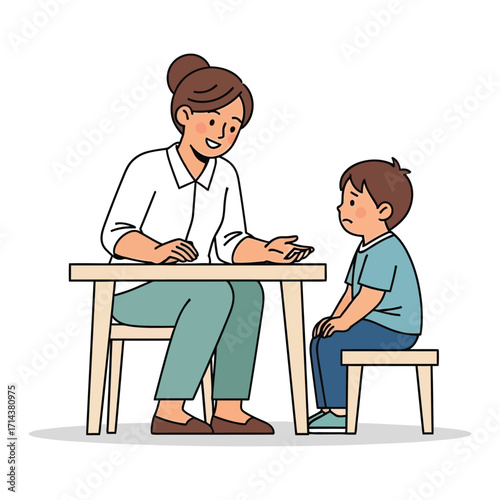 Counselor talking to a young boy about his feelings and emotions.