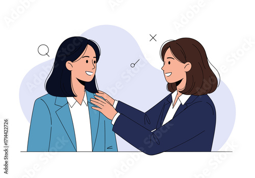 Two women in business attire sharing a moment of encouragement and support.