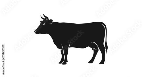 Silhouette of a black cow standing on a white background, showcasing its form.