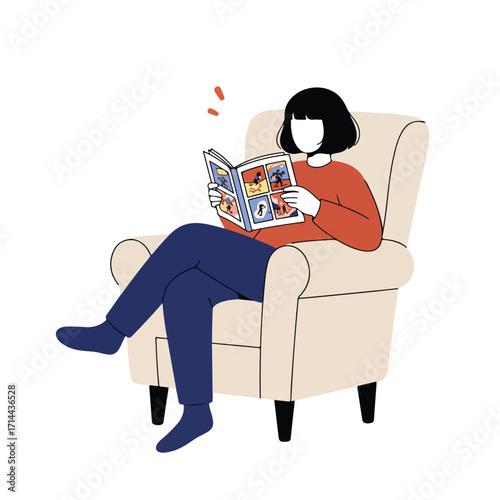 Woman in rust sweater reading a comic book sitting cross legged in a beige armchair