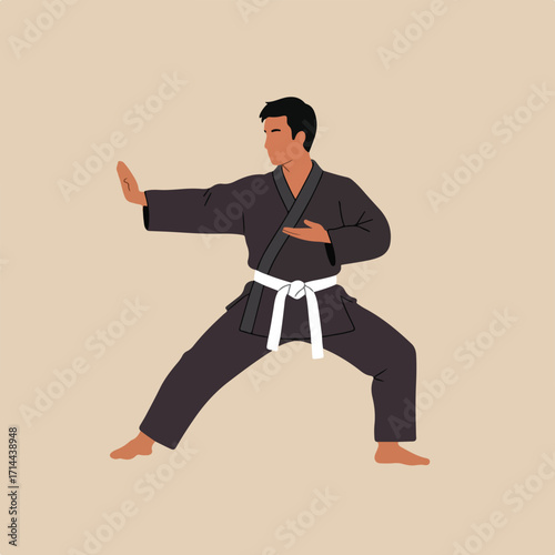 Man in Karate gi is in a defensive stance on a solid tan background