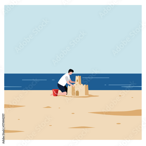 Child at seaside building a sandcastle with bucket, blue ocean and sky in the background