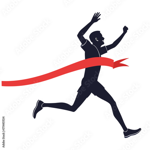 Silhouette of a triumphant male athlete breaking through a red finish line ribbon with arms raised in celebration of victory and achievement in a race