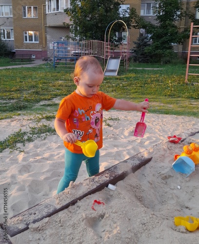 little boy playing on playground