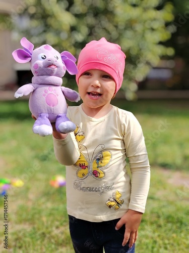little girl with a toy