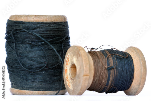 Vintage wooden thread spools on white background