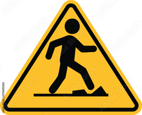 A yellow triangular warning sign indicating a trip hazard, with a pictogram of a person stumbling over an obstacle.