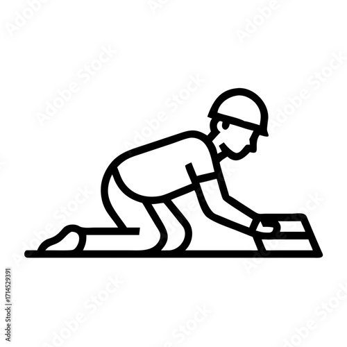 Worker laying laminate flooring while kneeling on surface  