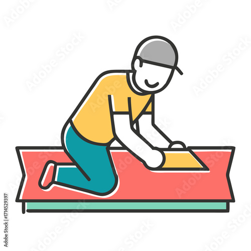 Young man kneeling while installing laminate flooring in a room  
