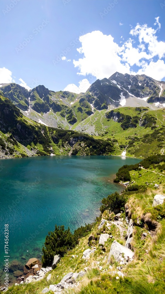 Fototapeta premium Mountain lake, vibrant turquoise water, lush greenery