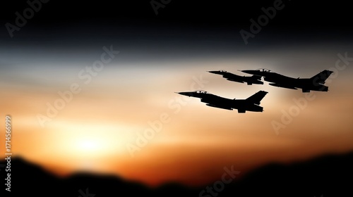 Military jets fly in formation against a beautiful sunset sky creating a striking silhouette in the evening hours