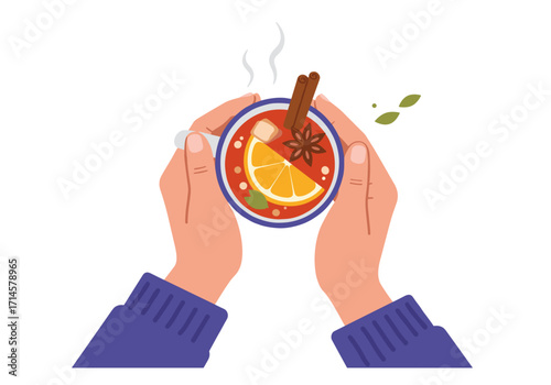 Warm spiced tea with orange and cinnamon in hands of person  