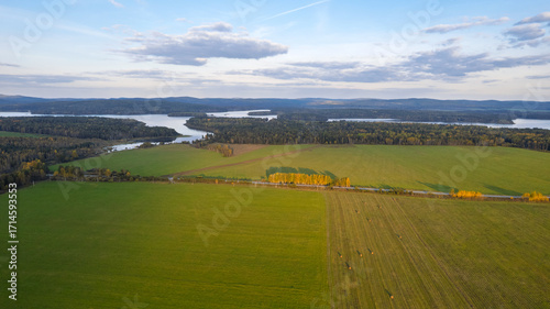 Aerial View of Green Fields, Forest and Lake at Sunset