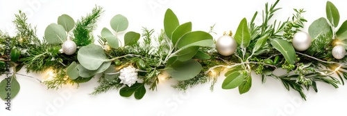 Festive christmas garland with golden ornaments and warm lights on white background