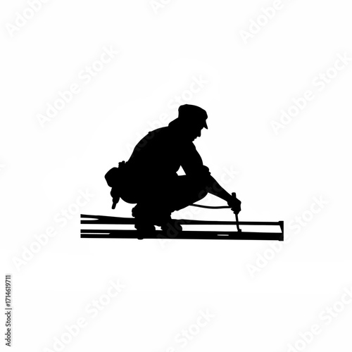 Silhouette of construction worker finishing concrete with tool isolated on white background