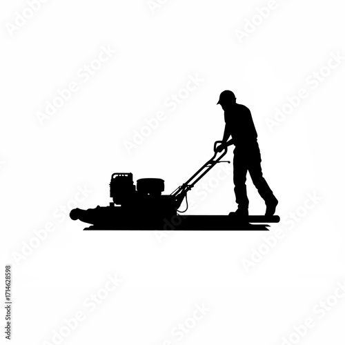 Silhouette of construction worker operating power trowel on concrete slab isolated on white background