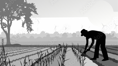 Sustainable farming silhouette with wind turbines in the distance for eco friendly agriculture concept