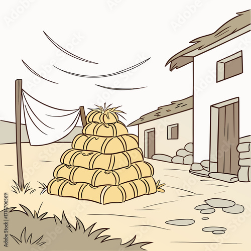 Stacked hay bales in a rustic farmyard with a simple building and a drying cloth