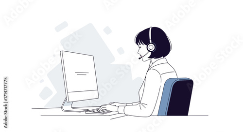 Person wearing headset works at computer in office.