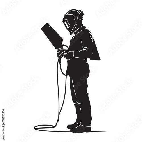 Welder holding equipment wearing protective gear welding