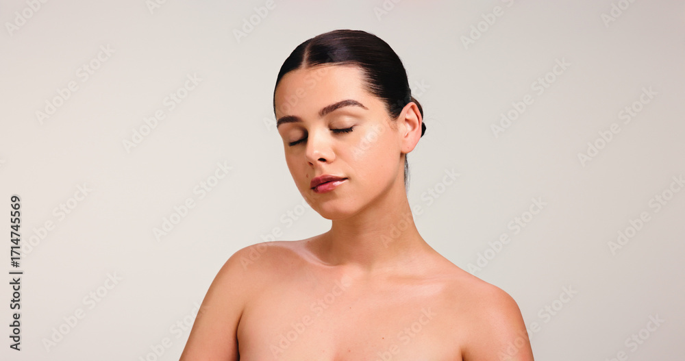 Fototapeta premium Eyes closed, woman and beauty in studio for self care, wellness and glow on white background. Mockup, space with clean girl makeup or dermatology for healthy skin shine, cosmetics or natural look