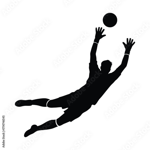 Soccer goalkeeper silhouette diving to catch the ball in mid air