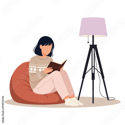 Woman in patterned sweater reading book on bean bag chair near tripod floor lamp vector