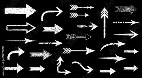 Collection of white chalk arrows pointing in various directions against a black background.