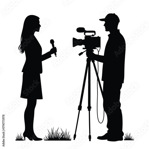 Female reporter interviews male videographer with camera on tripod