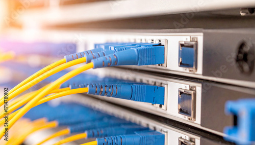 Fiber Optic Cables in Data Center. Server Rack with Fiber Optic Cables. Network Fiber Cables in Server Room. Digital Fiber Optic Connectors Close-up. Data Transmission with Fiber Cables