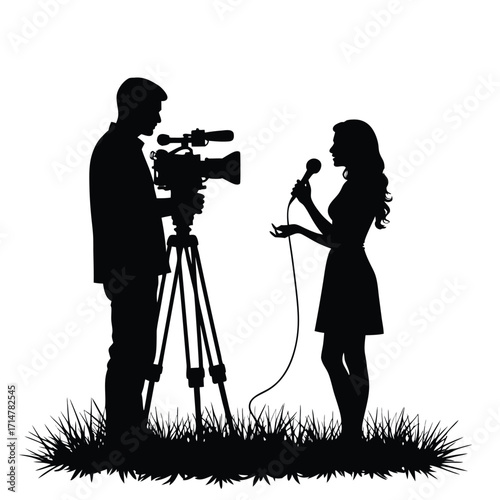 Silhouette of a man filming a woman holding a microphone
