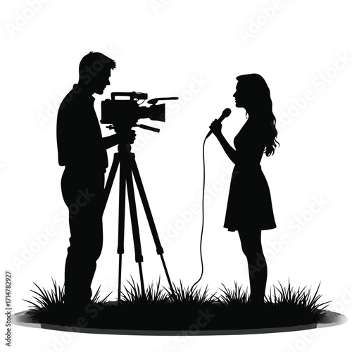 Silhouette of a man filming a woman speaking into a microphone