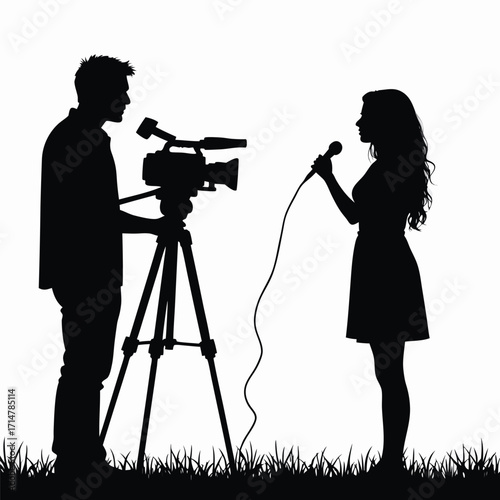 Silhouette of a man operating a video camera and a woman speaking into a microphone
