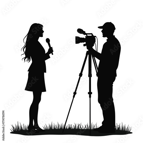 Silhouette of a woman interviewing a cameraman with grass