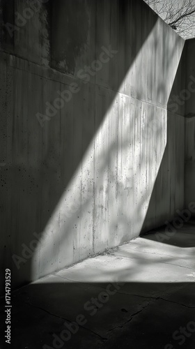 Light Beam Shines Through a Concrete Space Creating Dramatic Shadows in an Ur...
