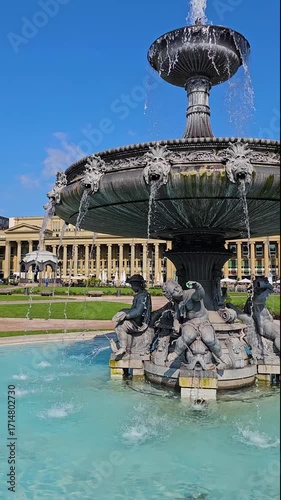 The water fountain in downtwon Stuttgart on a sunny day in spring in Germany. Vertical