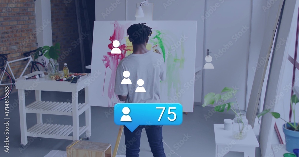 Naklejka premium Painting artist applying red yellow strokes on canvas in art studio loft, with easel and bicycle