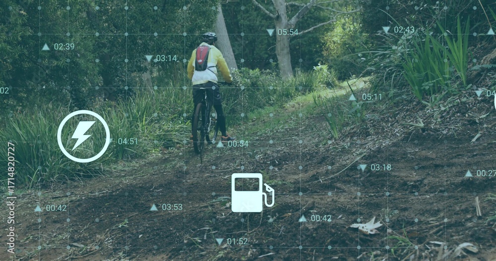 Fototapeta premium Pedaling mountain biker uphill forest trail with yellow jacket, helmet, bike and HUD overlay