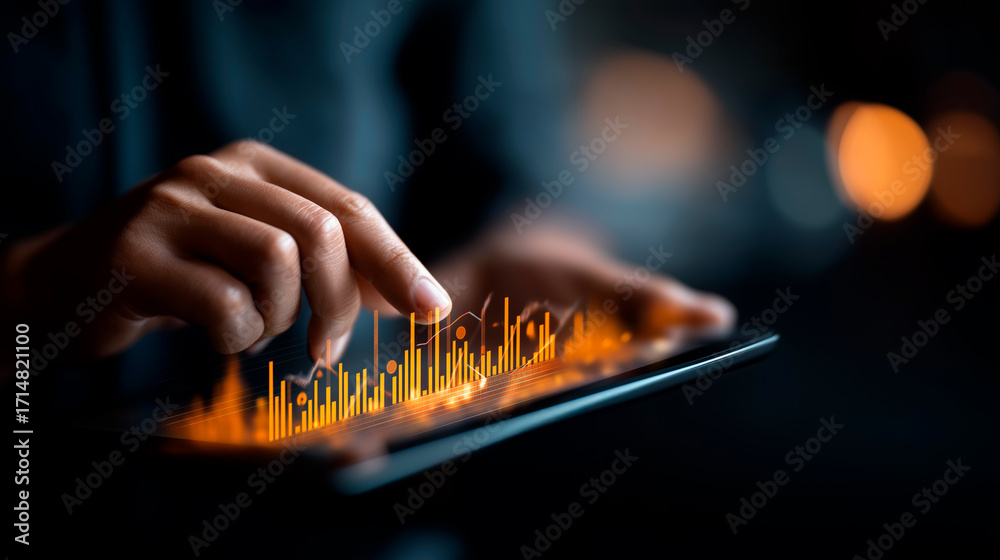 Fototapeta premium Data analyst hands studying data on digital tablet with futuristic graphs and charts hologram for big data and business analytics on dark background. big data analysis business