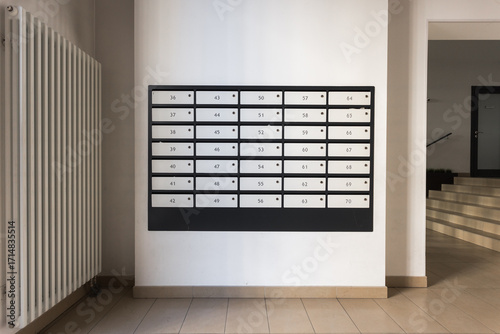 mailboxes in the lobby of an apartment building