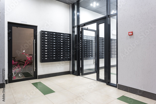 mailboxes in the lobby of an apartment building