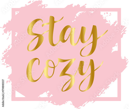 features the phrase "Stay Cozy" in elegant golden script font placed over a pink paint-stroke background framed with a soft square border.