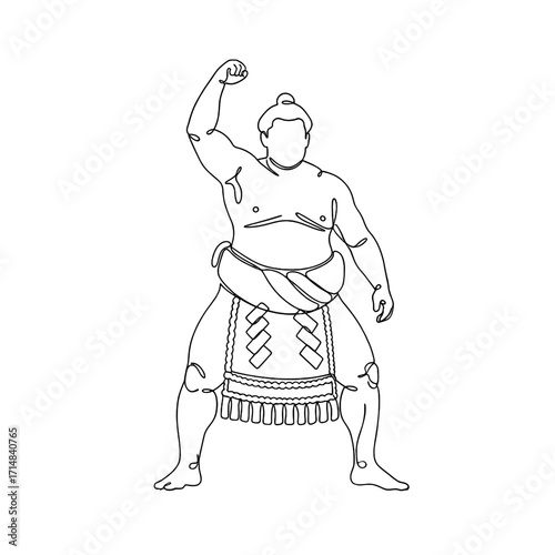 Sumo wrestler celebrating victory with raised fist in traditional attire  