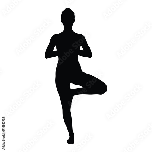 A woman performing a tree pose yoga a striking black silhouette