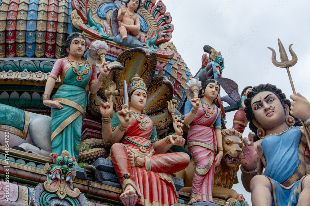 Fototapeta premium Colorful Hindu deities sculptures on temple facade
