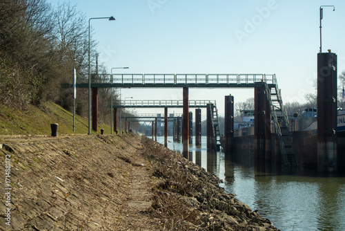 Obraz na plátně Elevated walkways along a tranquil waterway