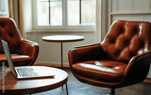 Stylish Brown Leather Chairs and Laptop in a Cozy Workspace With Natural Light