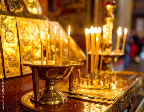 Lit candles on a golden altar