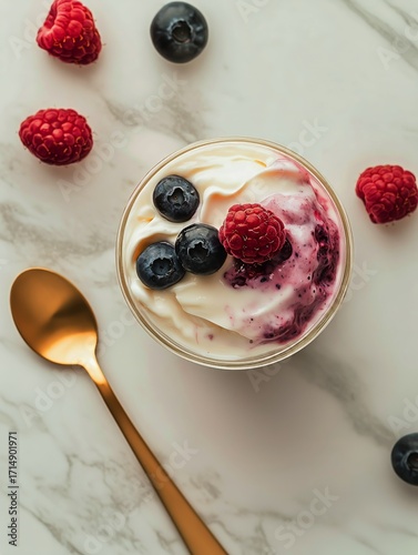 Delicious Yogurt Parfait Topped With Fresh Blueberries and Raspberries on a M...